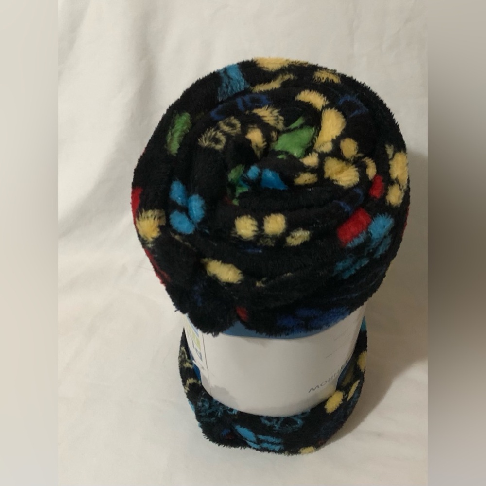 Black Plush Blanket Roll with Multicolor dog bones and Paw Print Pattern. 50X60